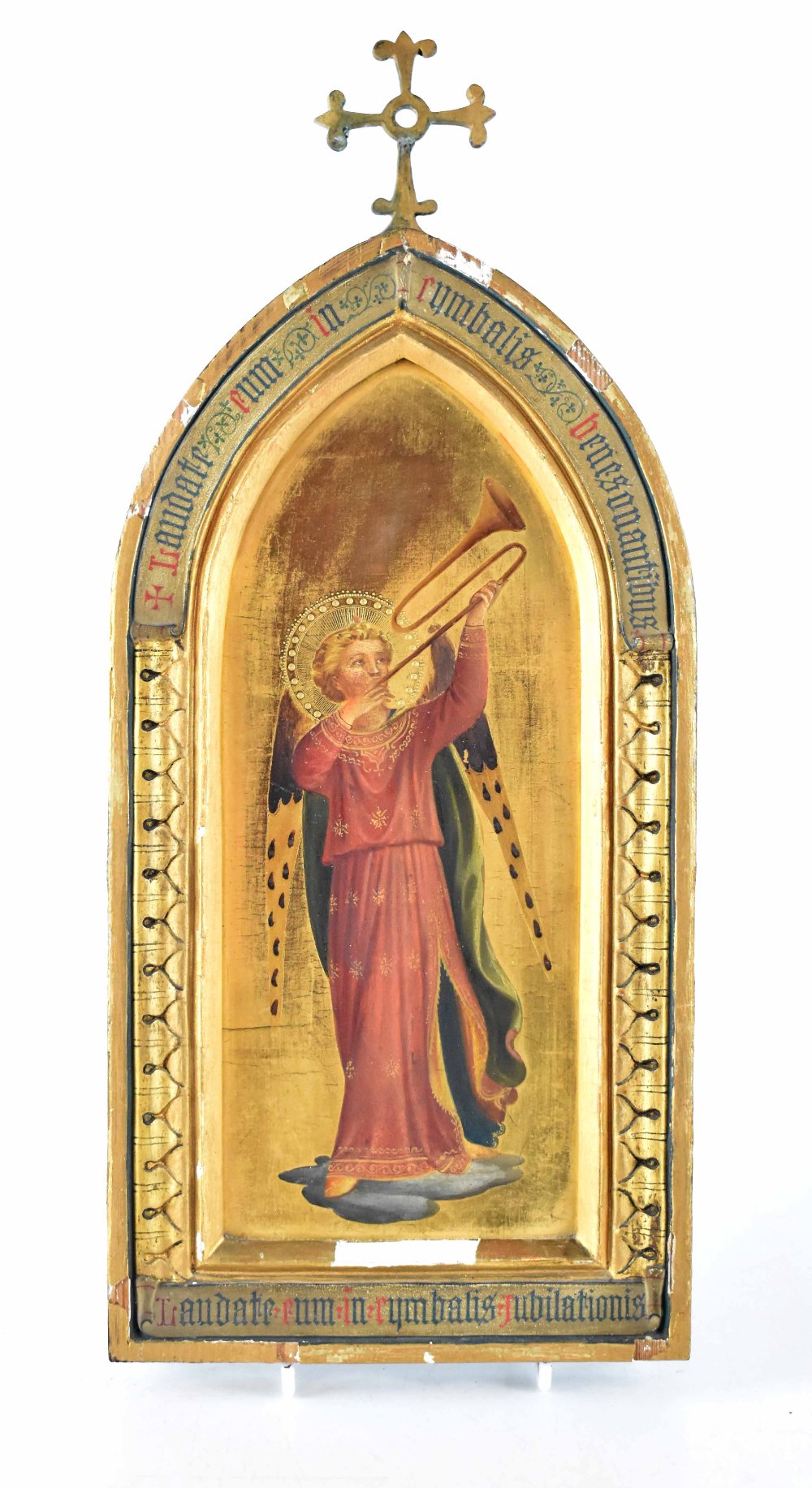 A late 19th century icon depicting Saint Michael with horn in carved arch under metal cross,