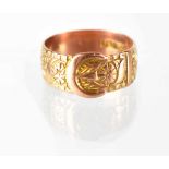A 19th century hallmarked 9ct gold buckle ring decorated with rosettes within a square dot border,