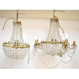 A pair of gilt metal five-branch chandeliers with rows of cut faceted circular drops in a 'bag'