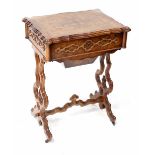 A Victorian walnut work table,