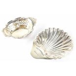 A George V hallmarked silver shell dish resting on three ball feet, length 10.