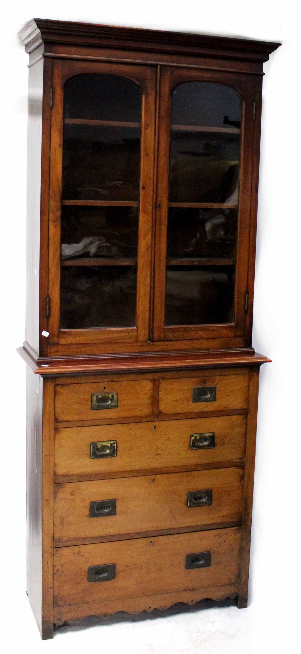 A 19th century mahogany two-over-three chest of drawers to block supports and an associated twin