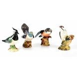 Four Beswick bird figures comprising 2315 gloss 'Cuckoo' height 12.