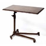 A 19th century oak and cast iron adjustable reading table, 74 x 44cm.