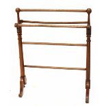 An Edwardian mahogany freestanding towel rail.