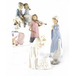 A group of Nao figures comprising 1034 'Nina Violin', 0245 'Patito Optimista',