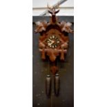 A Swiss cuckoo clock, dial set with Roman numerals,