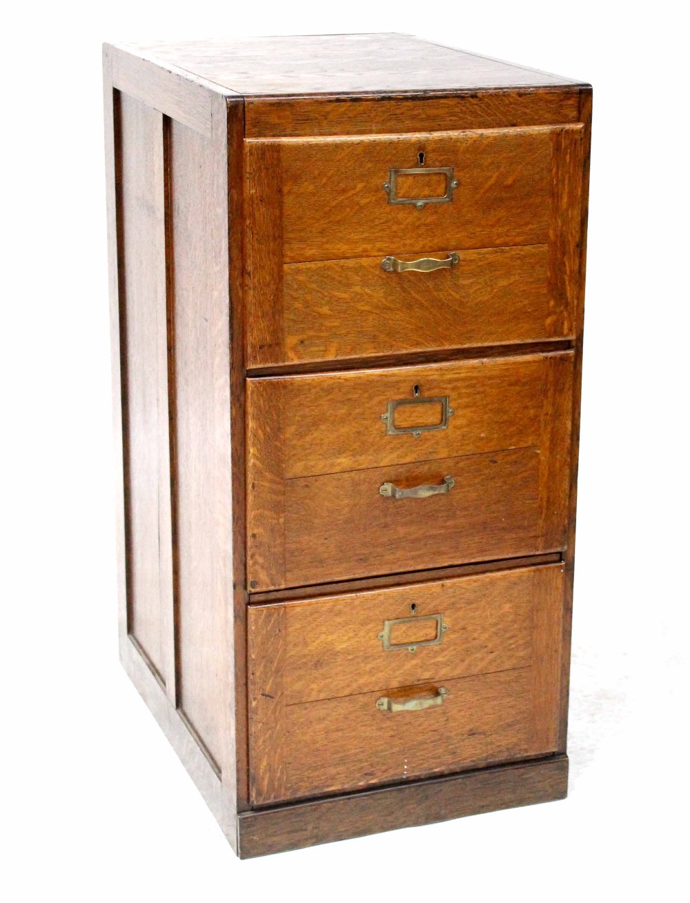 An early/mid-20th century oak three-drawer filing cabinet to plinth base, 102 x 49 x 66cm.