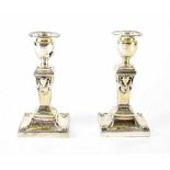 A pair of George III hallmarked silver squat candlesticks,