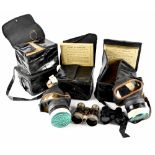 Four WWII Henley civilian gas masks to include three in an 'as issued' condition (two 2526 and a
