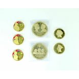 Seven gold plated collectors' coins comprising 'Longest Reigning Monarch', diameter 100mm,