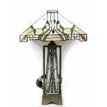 A Tiffany-style table lamp with square shade with Art Nouveau foliate motifs in green,