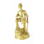 A heavy cast brass model of a miner, height 29cm.