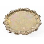 A George II hallmarked silver card dish with piecrust edge with shell and C-scroll motifs,