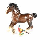 A Beswick cantering shire horse, brown gloss, model 975, height 22cm and a Beswick pheasant,