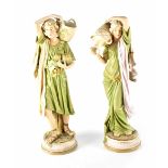 A pair of early 20th century Royal Dux figures, male and female in the Classical style,