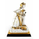 A Carpie porcelain model of an Oriental warrior leaning forward and with weaponry, gilt highlighted,