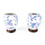 A pair of 20th century Oriental blue and white ovoid vases or ginger jars,