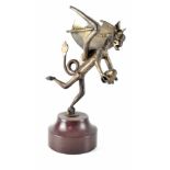 A metal sculpture of a dragon holding a rugby ball, signed Dylon on hardstone base, height 31cm.
