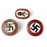 Two National Socialist German Workers' Party badges, one enamelled,