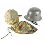 Two German helmets to include a WWI helmet, repainted with modern liner,