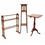 An Arts & Crafts oak plant stand with two square shelves, on slender square supports, height 110cm,