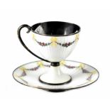 M HAMMER; a silver and enamel chocolate cup and saucer,