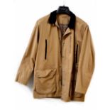 A Brooke Taverner tan coloured rain jacket with brown corduroy collar.