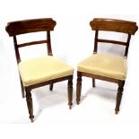 A set of five 19th century mahogany dining chairs with plain bar backs above stuff-over seats,