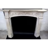 A Georgian-style fibreglass fire surround with scroll and foliate motifs and reeded pilasters, 107.