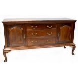A 19th century style mahogany sideboard comprising three drawers and two cupboards,