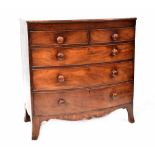 A 19th century bow-fronted mahogany chest of two short over three long graduated drawers with