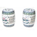 A pair of modern Chinese ceramic garden seats with pierced and painted lilypad and crane decoration,