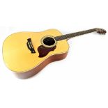 A Crafter six-string 'Dreadnought' natural acoustic guitar with a spruce top and mahogany back and