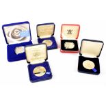 Five silver collectors' coins to include a commemorative millennium medallion,