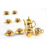 A Bernadotte gilt decorated part coffee service comprising six cups and saucers, lidded sugar bowl,