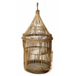 A large local crafts made French-style circular wicker bird cage with tapering roof and suspension