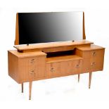 A c1970s retro teak mirror-back dressing table,