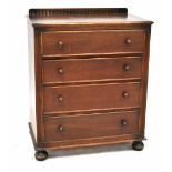 A 20th century oak priory-style chest of four long drawers raised on bun feet, height 95cm,