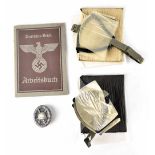 A German WWI Silver Wound Badge, a German WWII 'Arpeitsbuch',