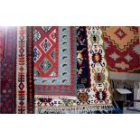 Four various sized Kilim woven woolen rugs, all South American inspired abstract designs,