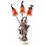 An Art Nouveau style lamp in the form of a maiden with a cherub, on a circular base,