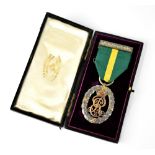 A King Edward VII Territorial decoration medal with green ribbon with yellow band,