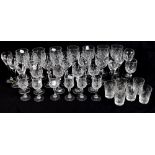 A group of crystal and cut glass drinking glasses including nineteen wine glasses and twenty nine
