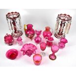 A pair of ruby glass lustres with clear drops (one af) and a group of cranberry glass including dish