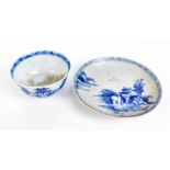 A Chinese Nanking Cargo porcelain tea bowl and saucer with typical underglaze blue decoration,