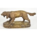 A decorative French bronze figure of a dog raised on oval plinth, length 24cm.Additional