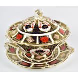 ROYAL CROWN DERBY; an ‘Old Imari’ pattern twin handled tureen, cover and stand, second quality,