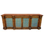 A monumental Victorian figured walnut and inlaid breakfront four door credenza, the shaped top above