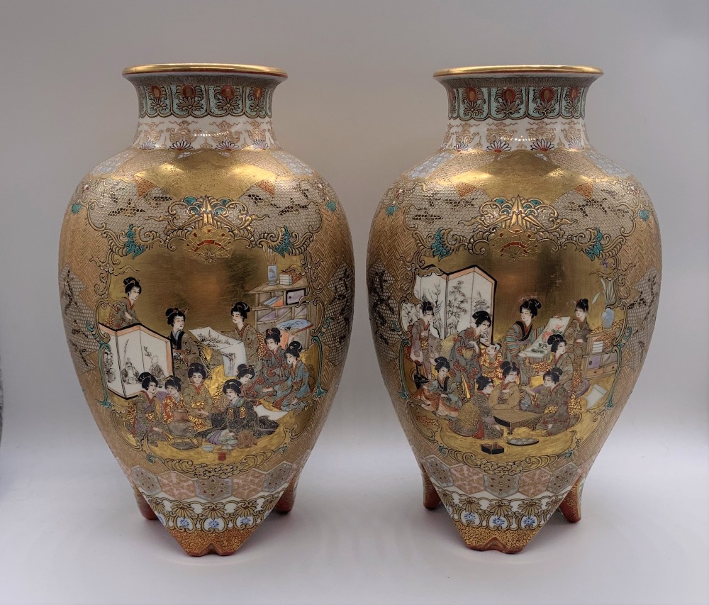 A pair of Japanese Meiji period Satsuma porcelain vases decorated with figures within a textured